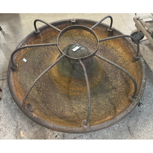 275 - A cast iron Mexican hat pig feeder
