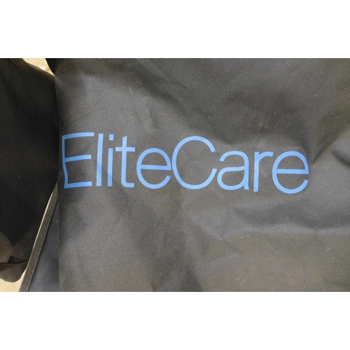 2265 - An Elite Care operator driven folding wheelchair with footrests and carry bag