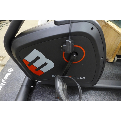 2275 - A Bodymax R860 seated exercise bike with floor mat