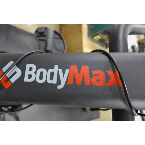 2275 - A Bodymax R860 seated exercise bike with floor mat