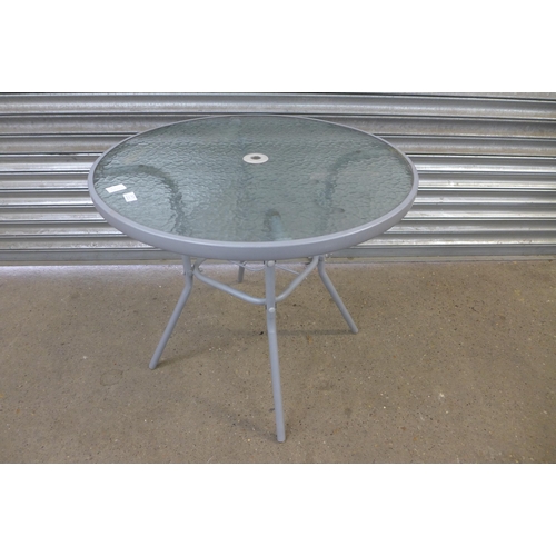 2277 - A grey metal and glass topped circular garden table