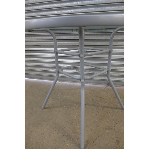 2277 - A grey metal and glass topped circular garden table