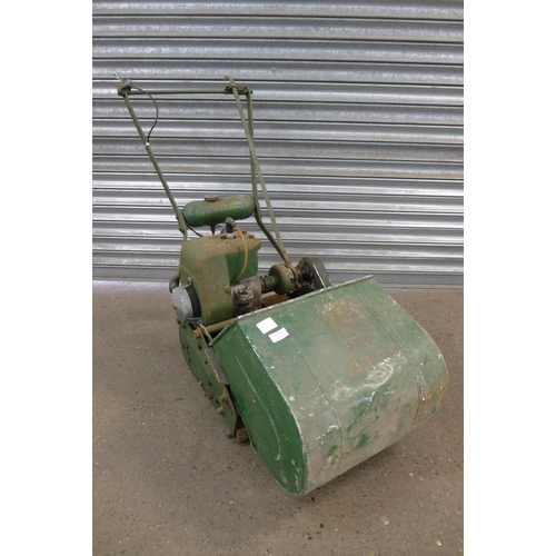 2279 - A vintage Atco petrol driven cylinder lawn mower with steel roller and collection box