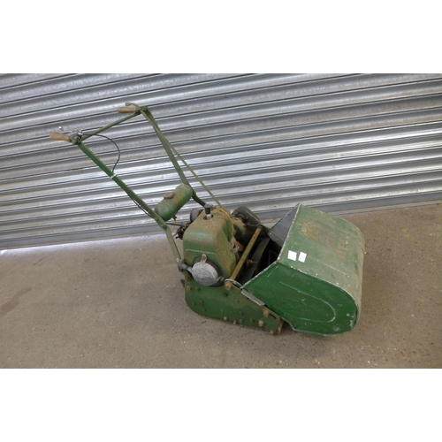 2279 - A vintage Atco petrol driven cylinder lawn mower with steel roller and collection box