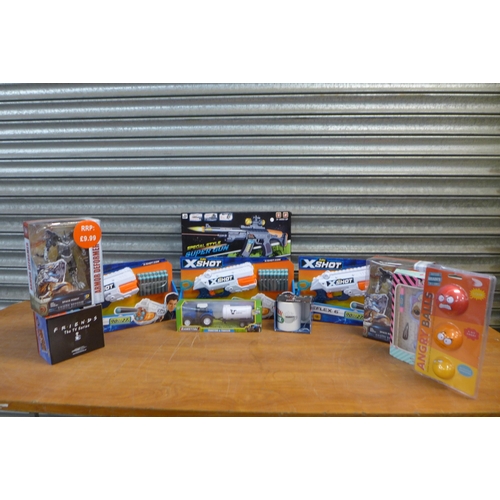 2306 - A box of assorted unused toys and games including XShot foam dart guns, stress balls, LOL Surprise h... 