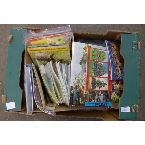 2310 - A box of trading card booklets - Brooke Bond/cigarette cards, etc.