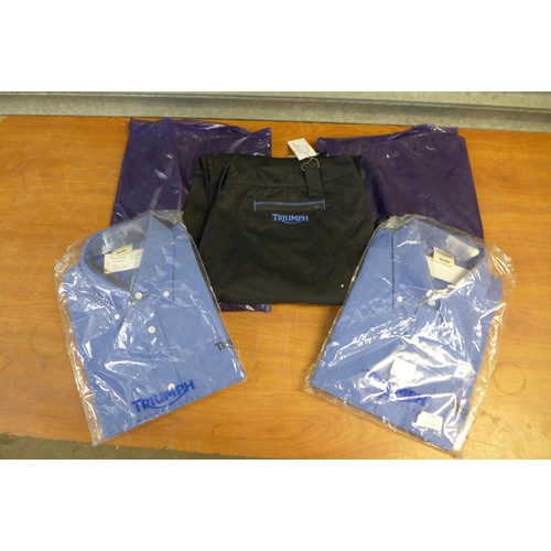 2378 - A quantity of Triumph motorcycles clothing including size XXXL and XXL navy workshop pants, XL shirt... 