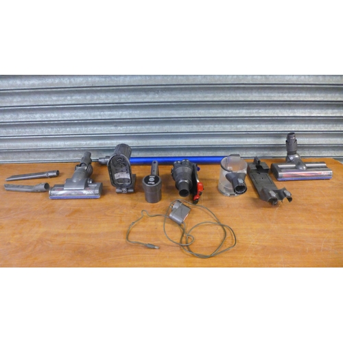 2189 - A quantity of Dyson vacuum parts and spares for repairs including brush heads, cyclone parts, motors... 