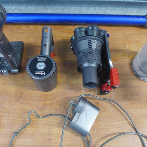 2189 - A quantity of Dyson vacuum parts and spares for repairs including brush heads, cyclone parts, motors... 