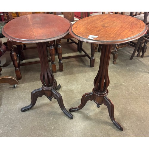 122 - A pair of simialr Victorian mahogany oval tilt top tripod tables