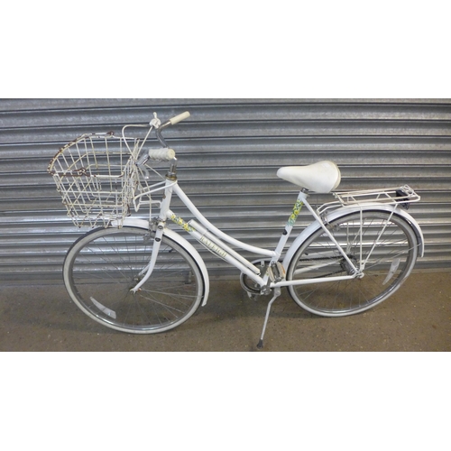 A Raleigh Caprice lady s Step Through bicycle with front basket and pannier rack