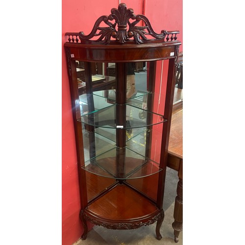 108 - A 19th Century style French carved mahogany bow front corner vitrine