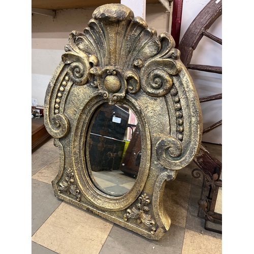 373 - A Rococo style gilt framed mirror