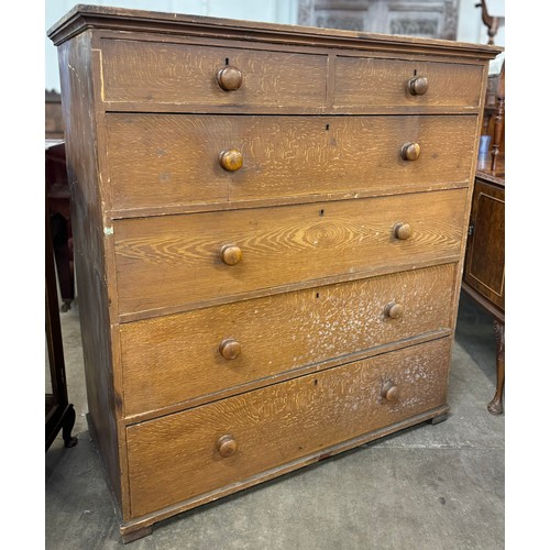 99A - A large Victorian scumbled pine chest of drawers