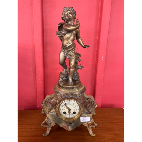378 - A 19th Century French gilt metal and onyx figural mantle clock