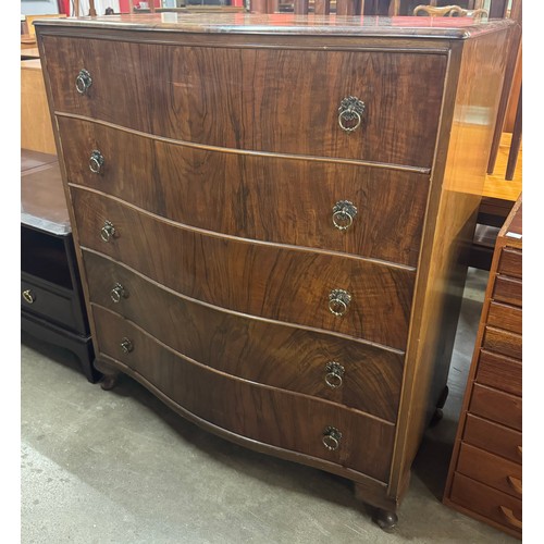 139A - A George I style figured walnut serpentine chest of drawers