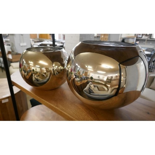 1319 - A pair of spherical silver glass vases