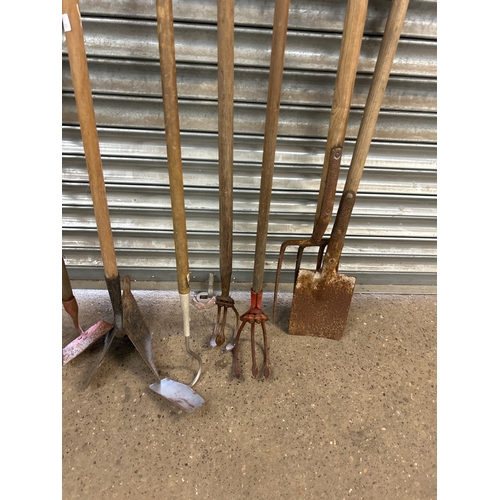 2226A - A quantity of garden tools including  forks, spades, plough etc.