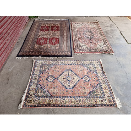 186A - Three assorted rugs (140x97cm, 200x123cm & 165x94cm)