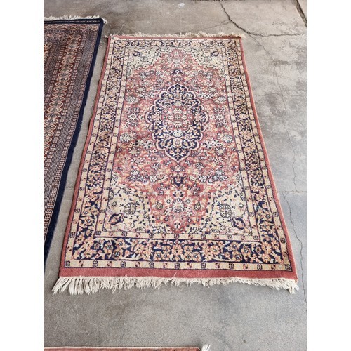 186A - Three assorted rugs (140x97cm, 200x123cm & 165x94cm)