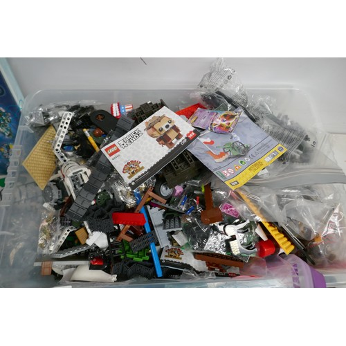 2053 - A plastic box containing a large amount of block building sets including LEGO and Cobi