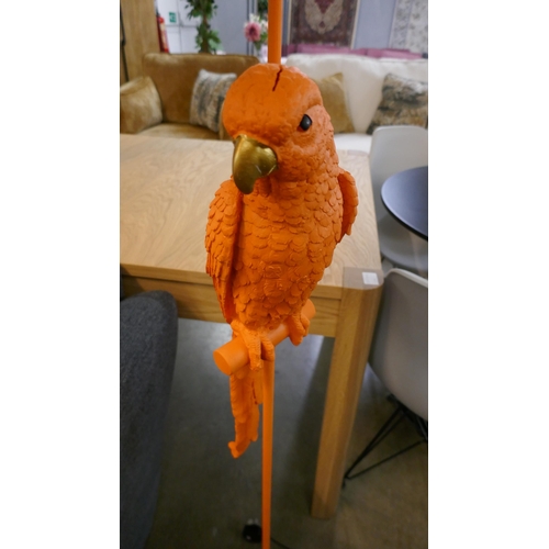 1366 - An orange floor standing lamp in the form of a parrot