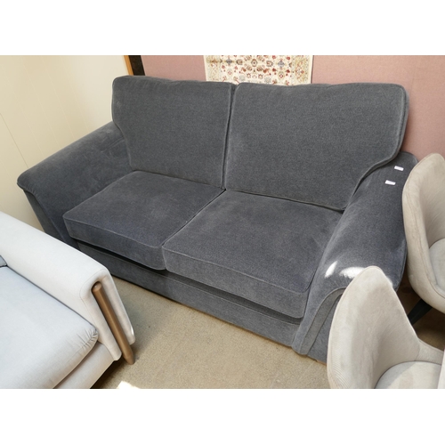 1371 - A deep blue upholstered three seater sofa