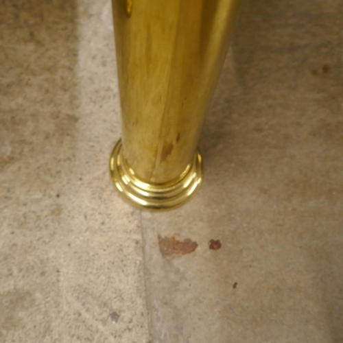 1415 - A square corner table, toughened smoked glass with solid brass legs