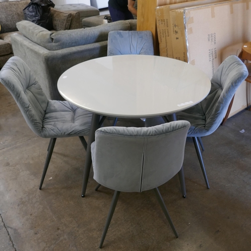 1446 - A Logan circular dining table and four Aran grey velvet chairs