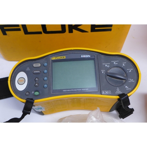 2027 - 2 Fluke tool boxes with various items inside including: a Fluke 6200 appliance tester, a Fluke 1653 ... 