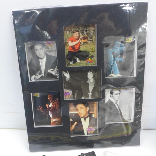 2030 - A crate of Elvis Presley collectibles including an ink wash set, prints, magazines, a watch in tin, ... 