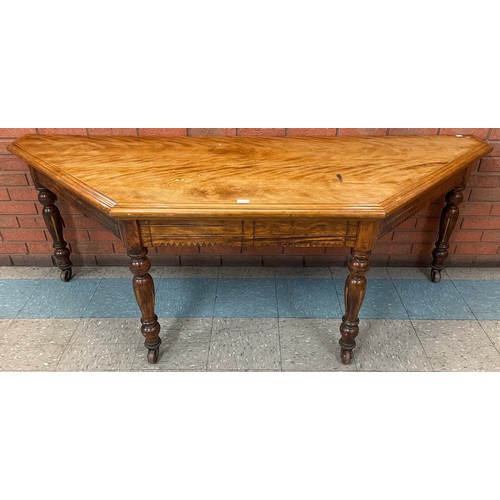 173 - A Victorian Aesthetic Movement walnut serving table