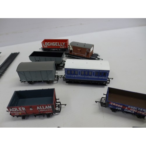 2048 - A quantity of Hornby OO gauge model railway track, carriages, electronic train controller etc.