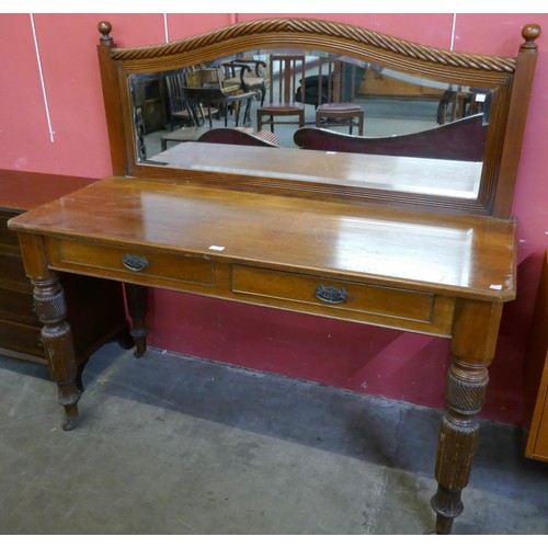 111 - A Victorian oak two drawer mirrorback serving table