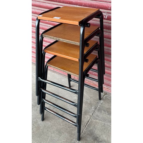 38 - A set of four teak and black tubular metal stools