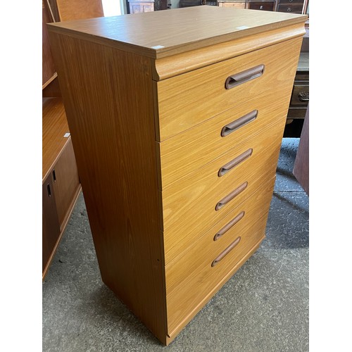 62 - A teak chest of drawers