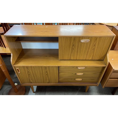 75 - A teak effect highboard and a beech standard lamp