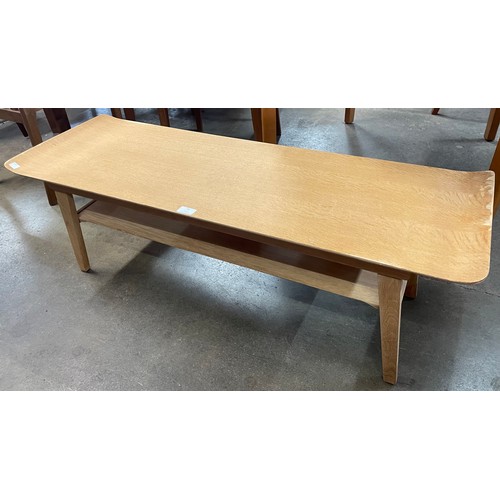 78 - A Myer light oak sleigh top coffee table