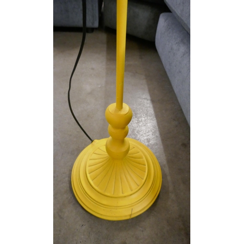 1342 - A yellow floor standing lamp in the form of a parrot