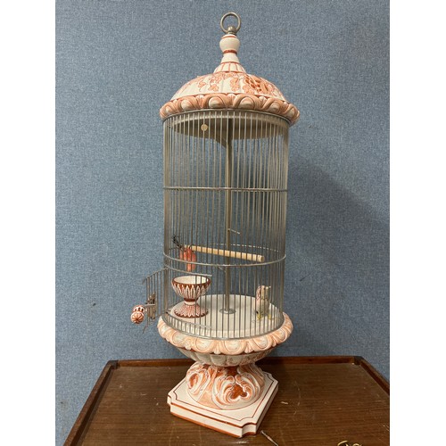 271 - A hand painted porcelain and metal birdcage