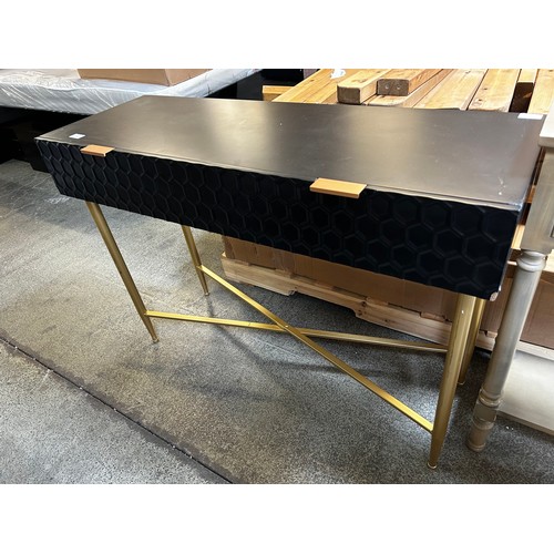 1544 - A black single console table with gold legs