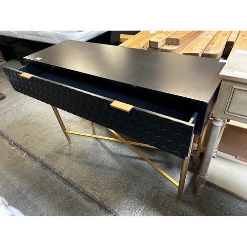 1544 - A black single console table with gold legs