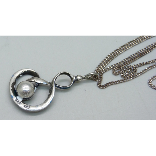 1063 - A Charles Horner silver and enamel pendant on a white metal chain, enamel a/f, 4cm