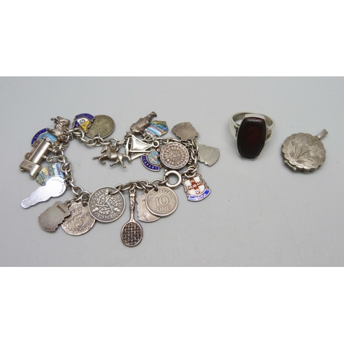 1076 - A silver Georg Jensen locket, a silver ring, and a plated bracelet with silver, white metal and plat... 