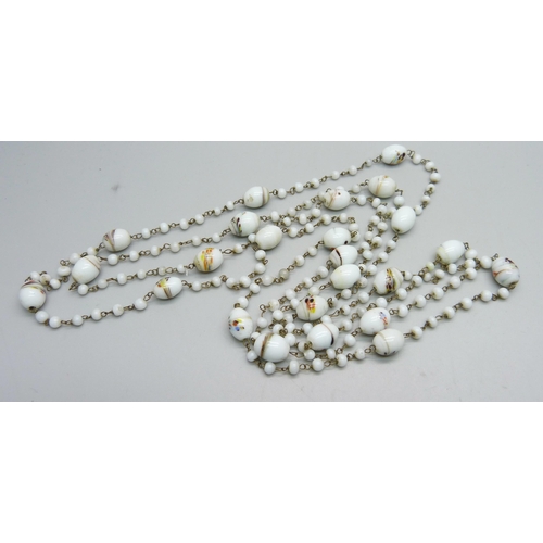 1082 - A vintage glass bead long guard chain, approximately 135cm