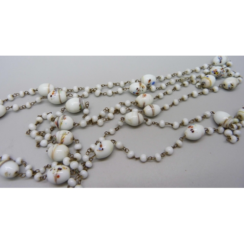 1082 - A vintage glass bead long guard chain, approximately 135cm