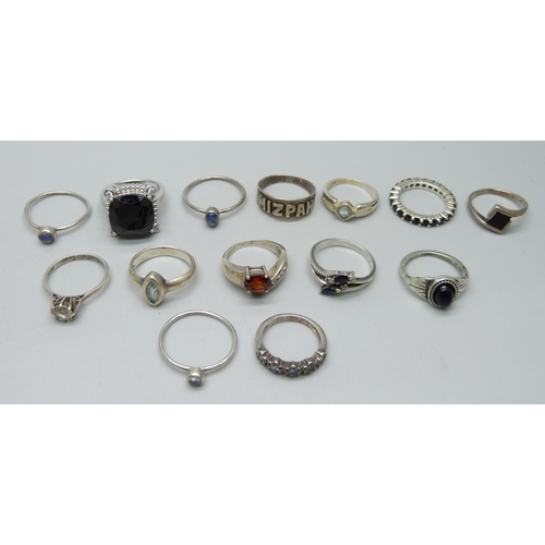 1088 - Ten silver rings, three white metal rings and a plated ring, 39g