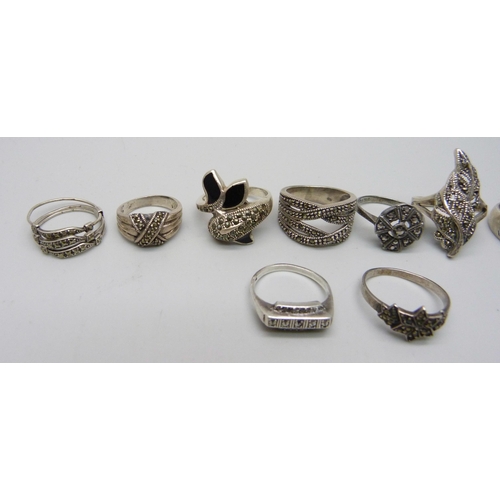 1100 - Nine silver and marcasite rings including a .800 example, together with an unmarked white metal ring... 