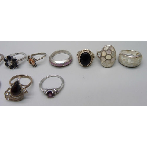 1106 - Eleven silver rings and a plated ring, 47g