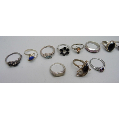 1106 - Eleven silver rings and a plated ring, 47g